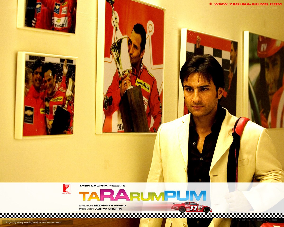 Actor in white suit with racing photos