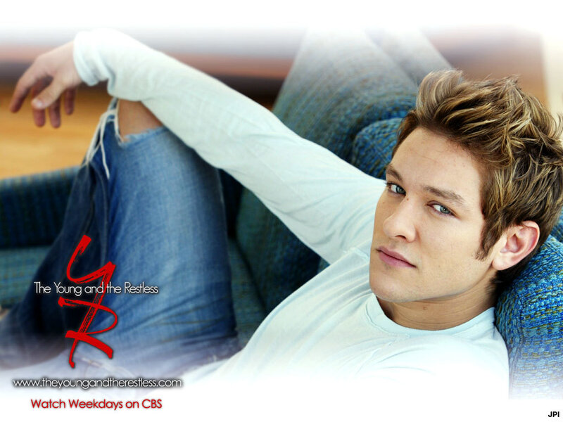 actor on couch promotional image