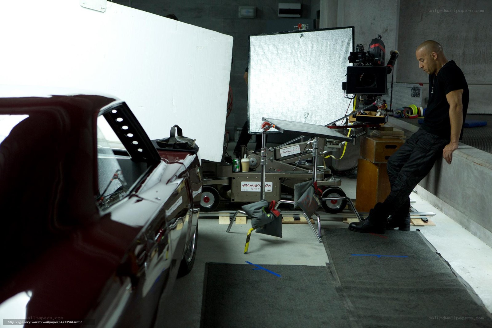 actor on film set with car
