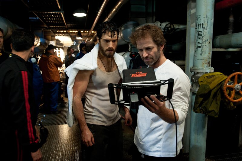 Actor on film set with crew