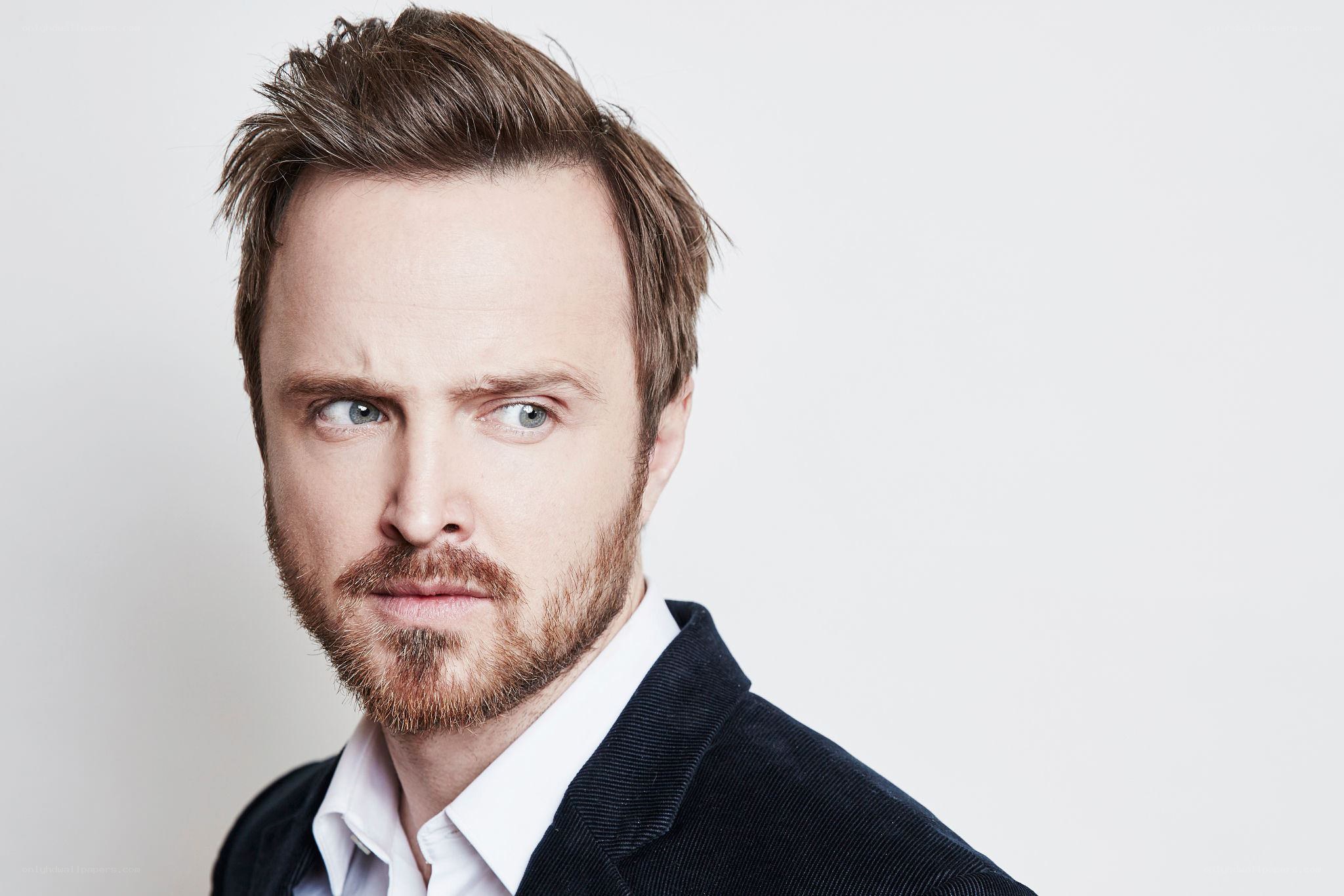 actor with beard and suit
