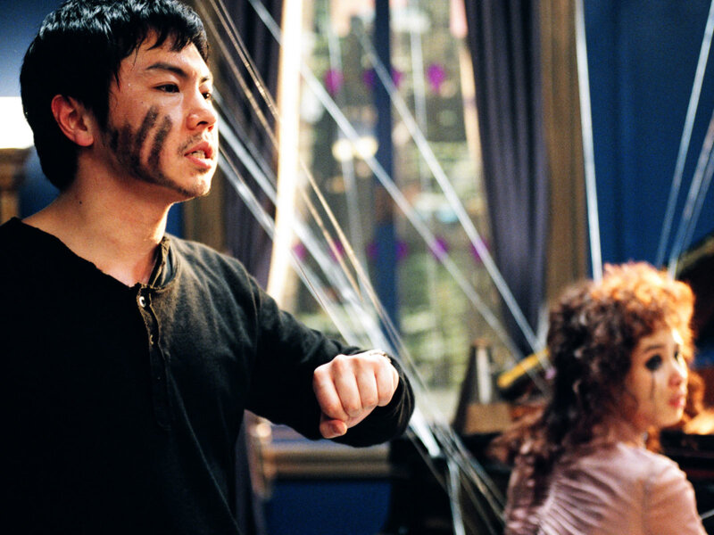 actor with face paint in scene