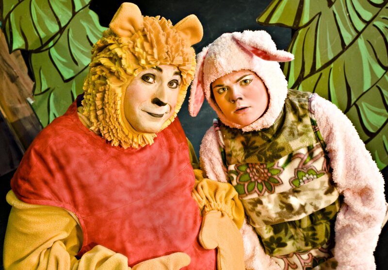 Actors in animal costumes on stage
