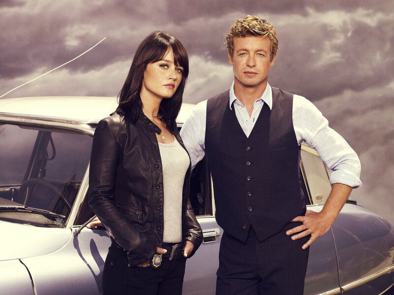 actors in front of classic car