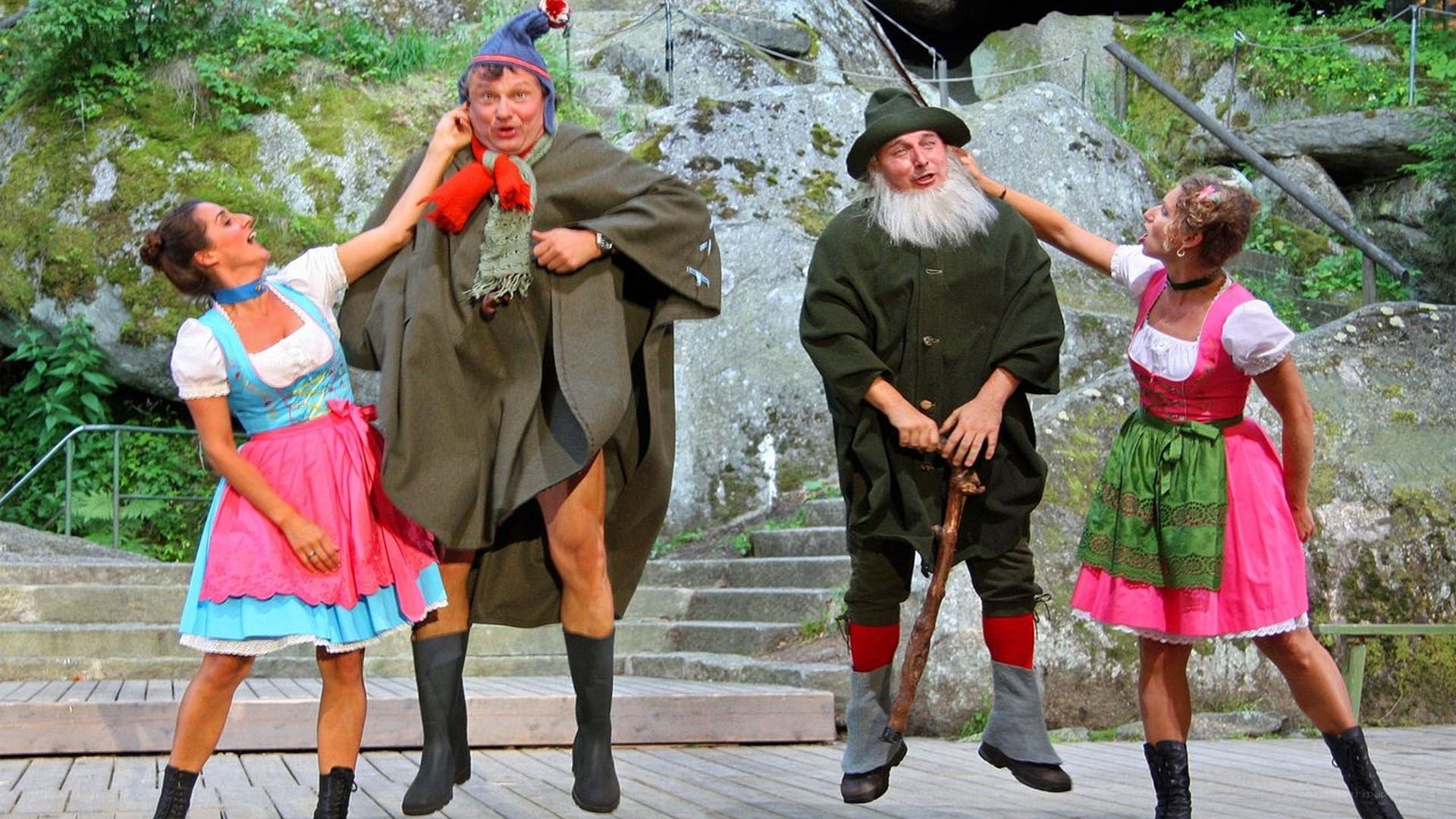 Actors in traditional costumes on stage