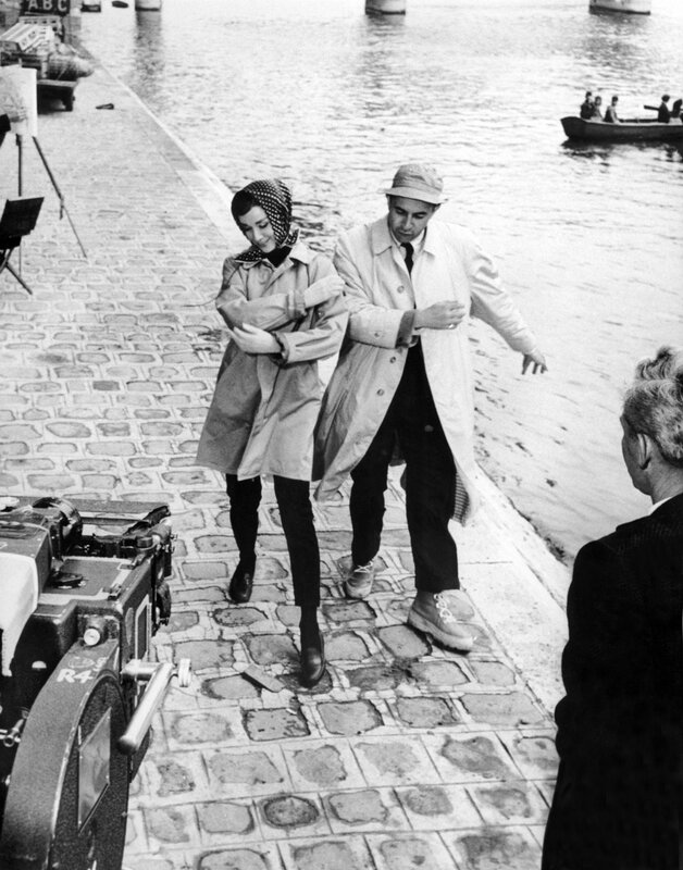 Actors on a film set by the water