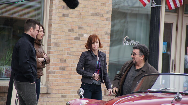 Actors on a film set outdoors