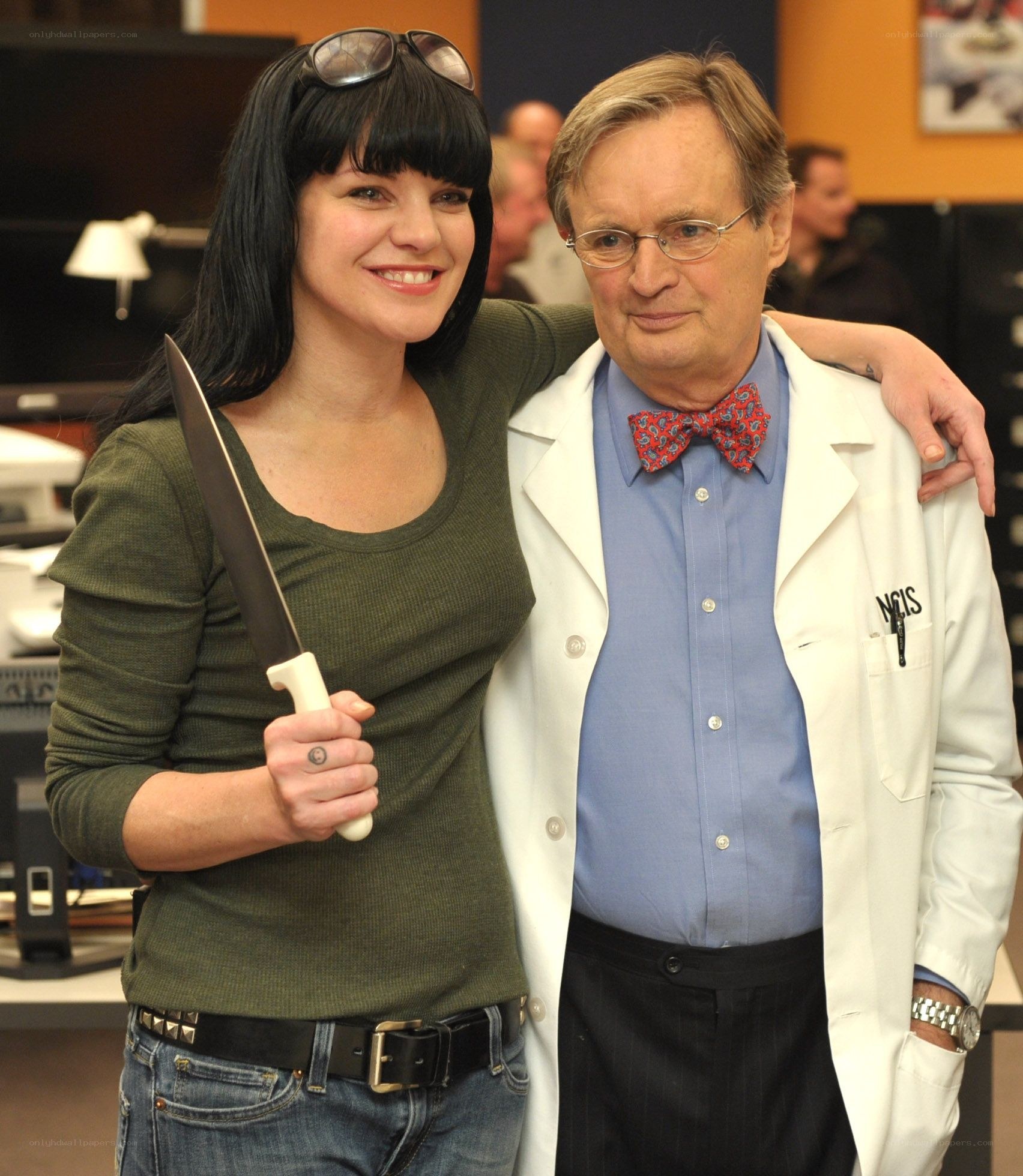 Actors on NCIS set with knife