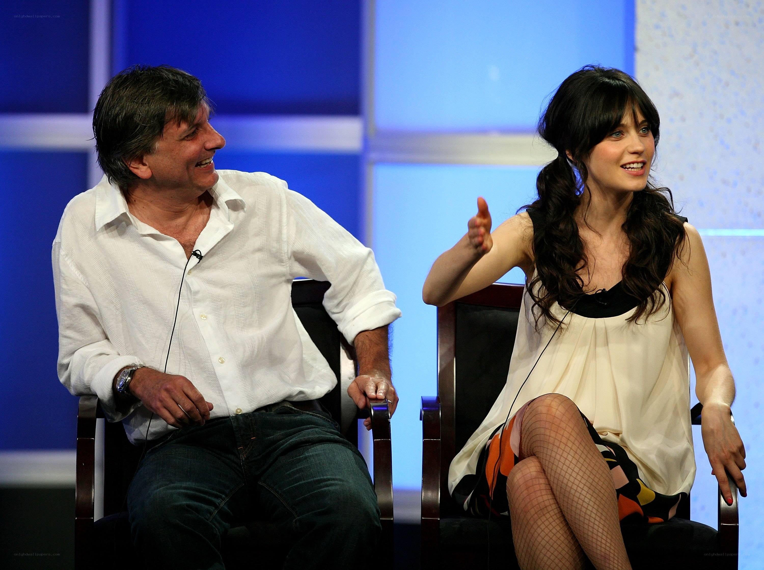 actors on stage laughing