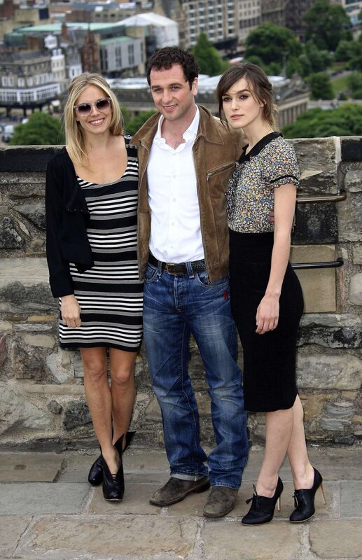 Actors posing on a stone terrace