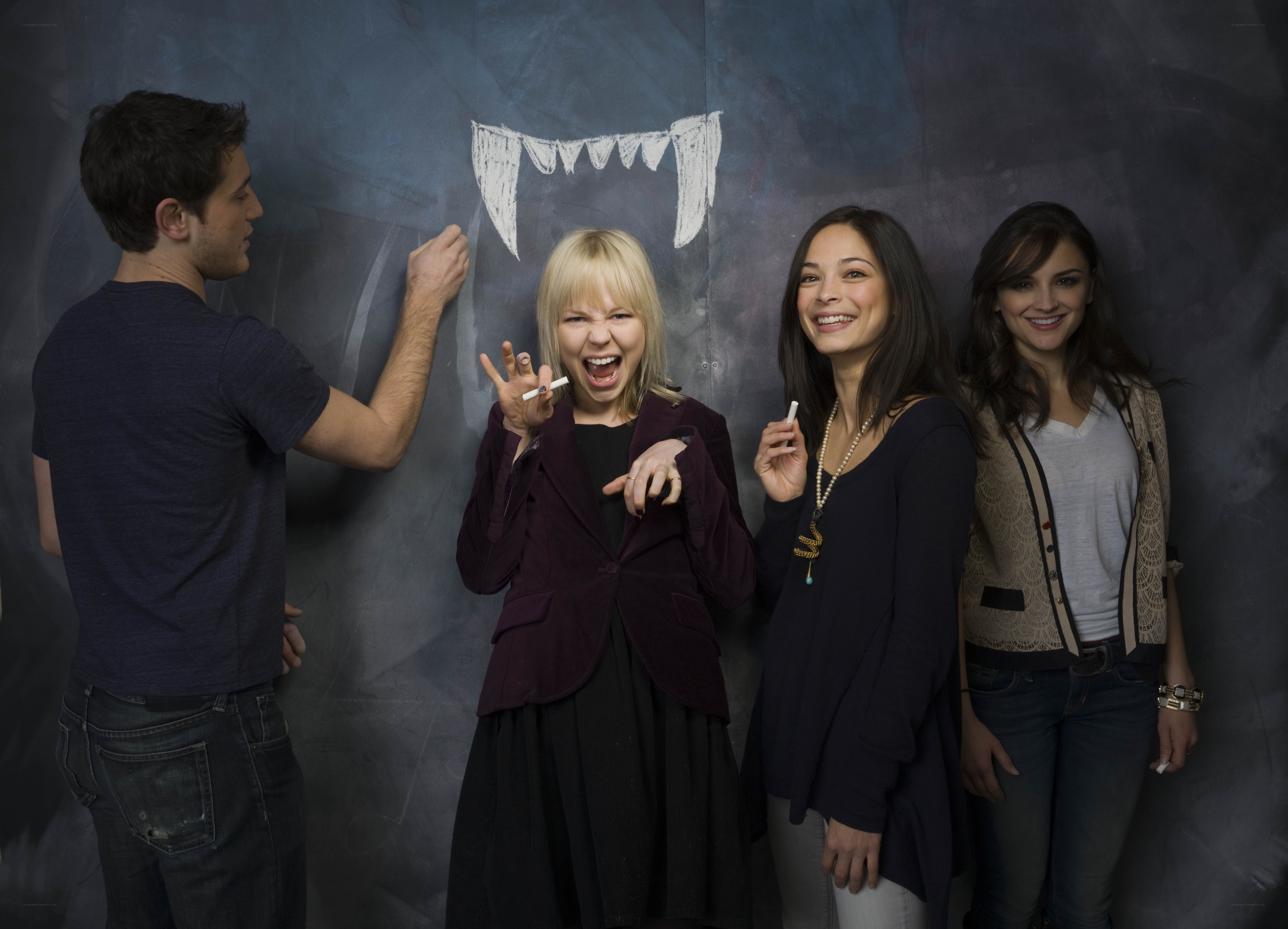 Actors posing with chalk drawing
