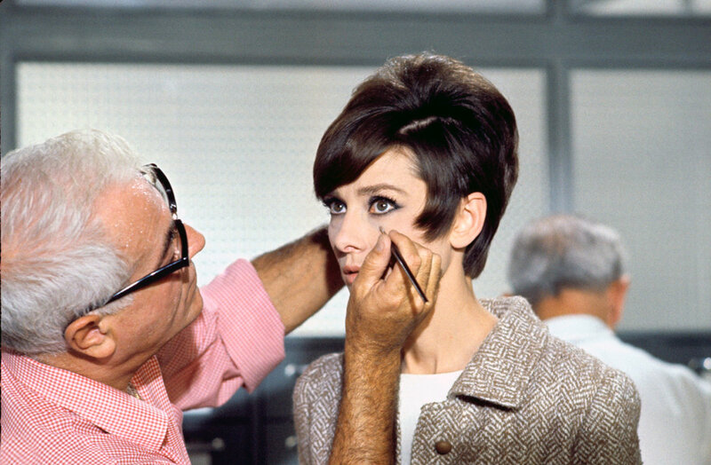 Actress getting makeup applied