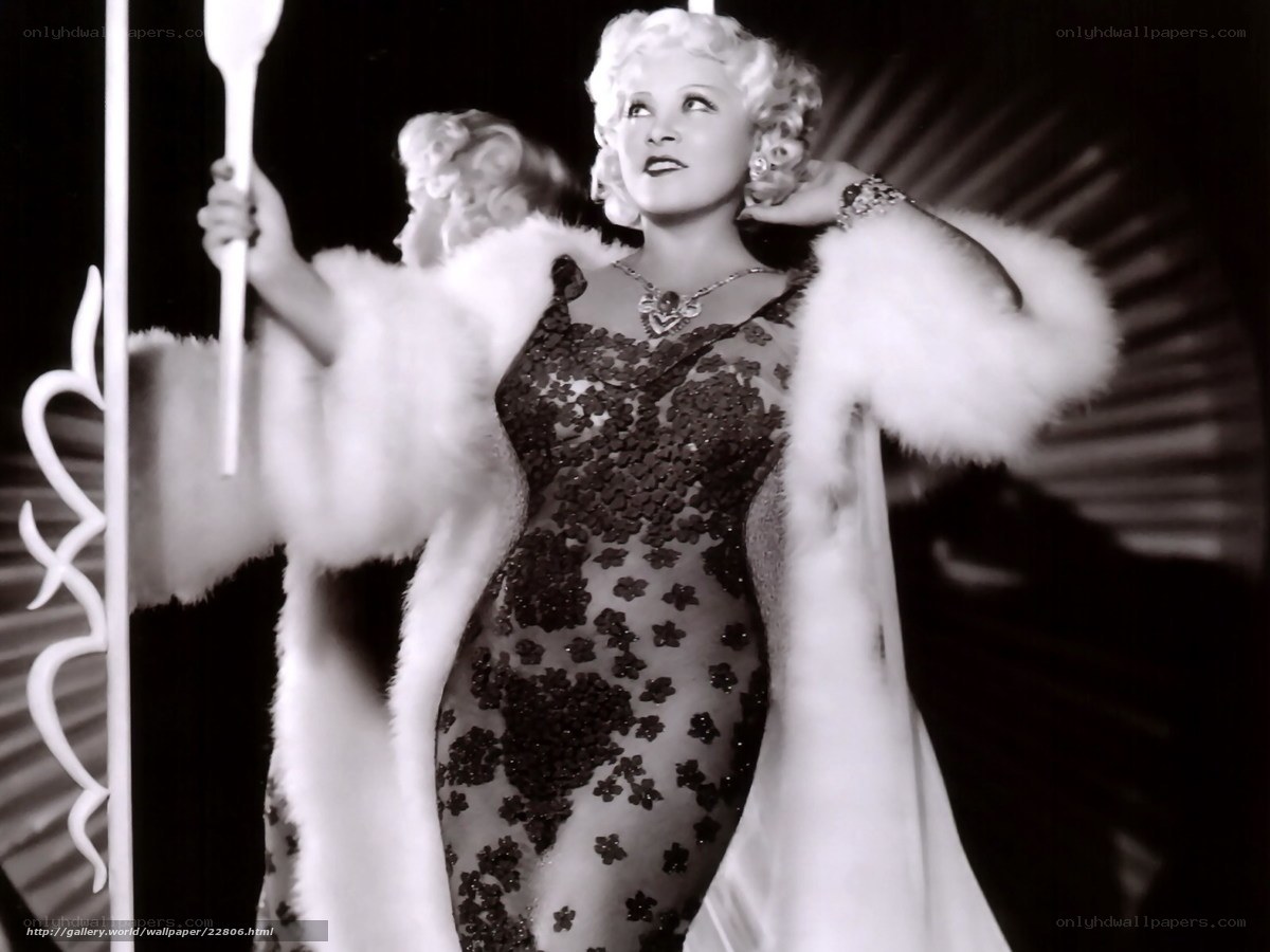 Actress in fur coat and sequined dress