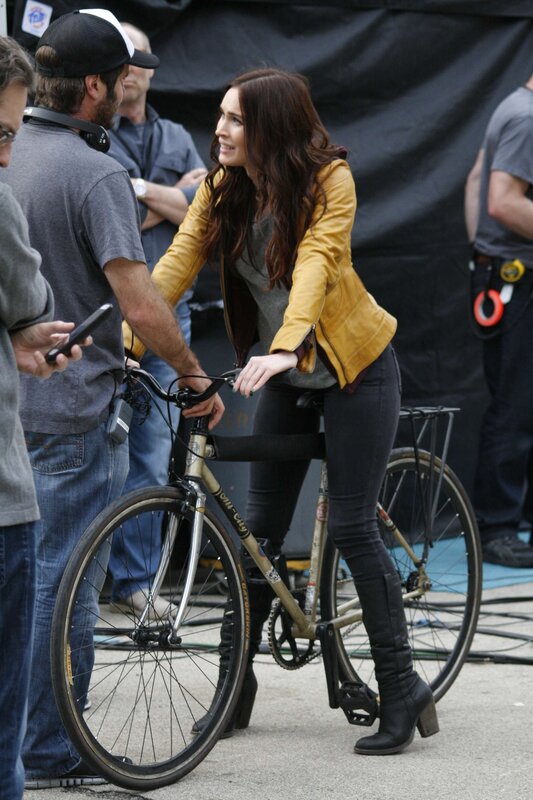 Actress on bicycle set