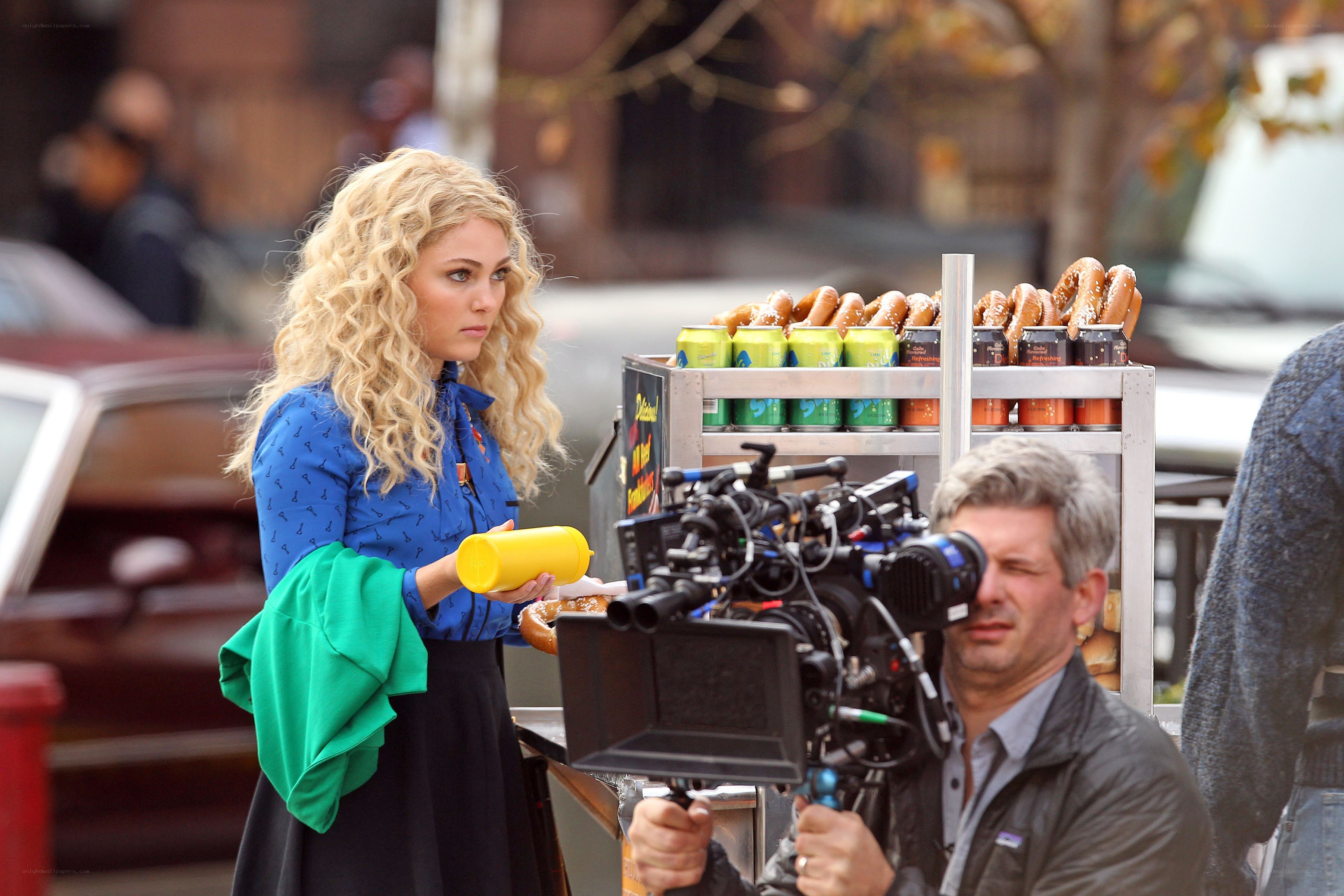 Actress on film set with camera
