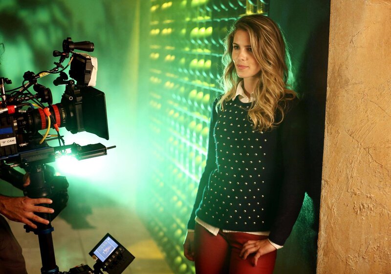 Actress on film set with camera