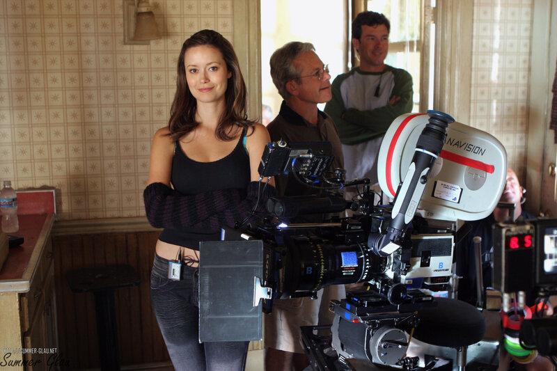 Actress on film set with camera