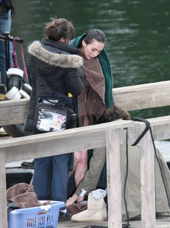 Actress on set near water
