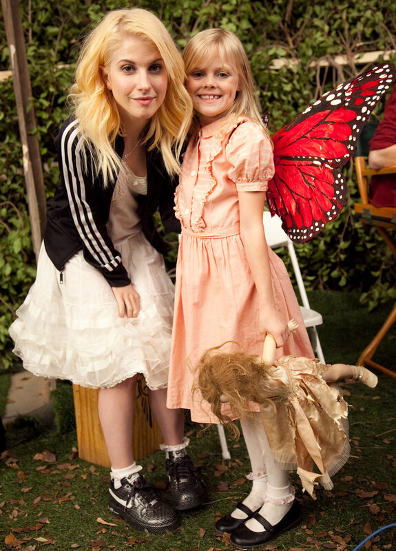 Actress with young actress in costume