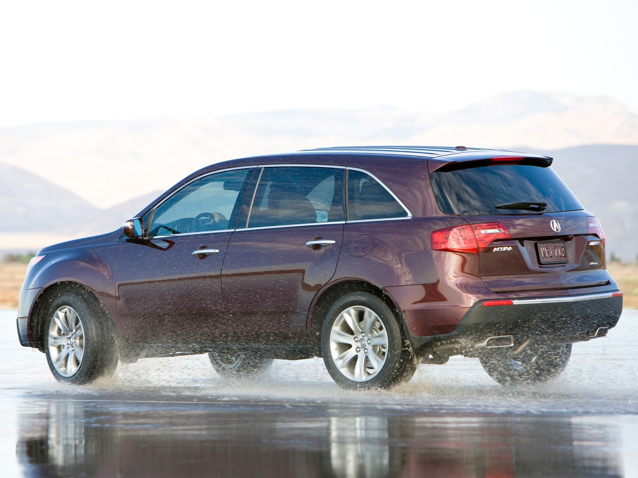 Acura MDX driving through water