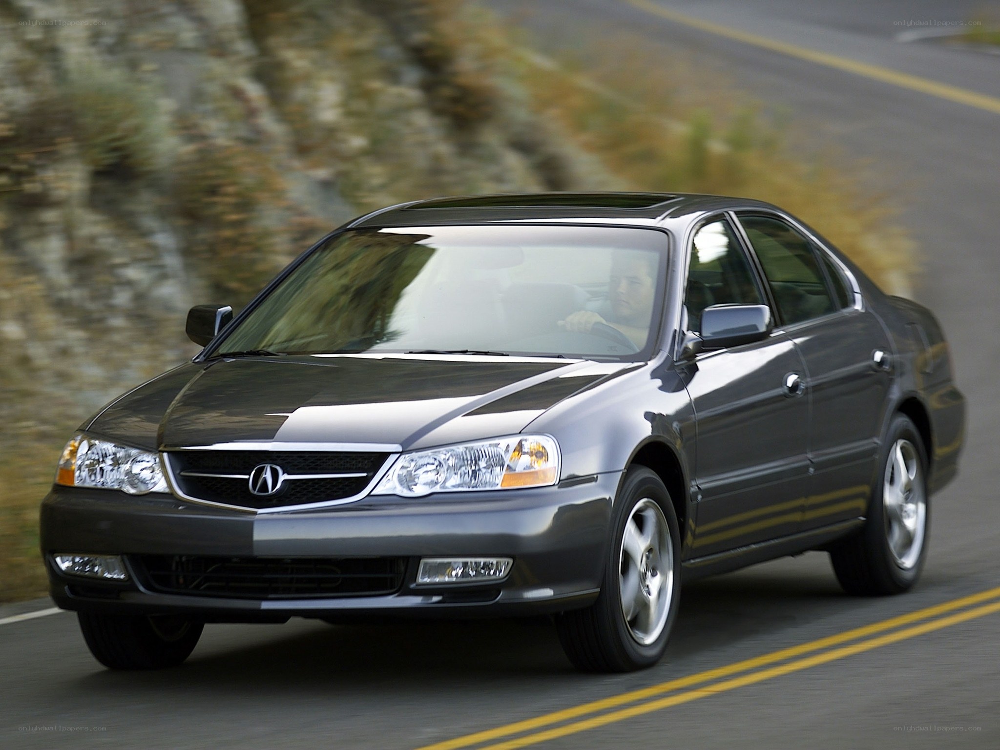 Acura TL driving on a road