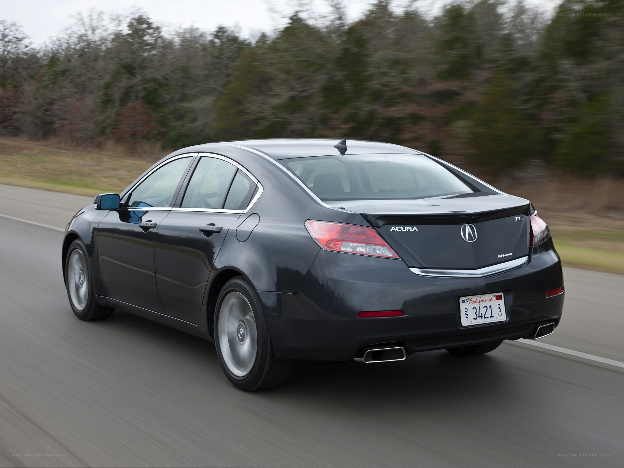 Acura TL driving on a road