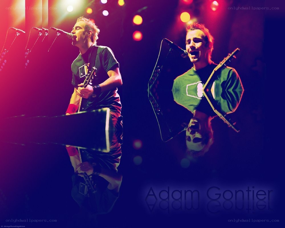 Adam Gontier performing on stage