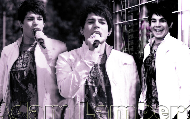 Adam Lambert performing with band