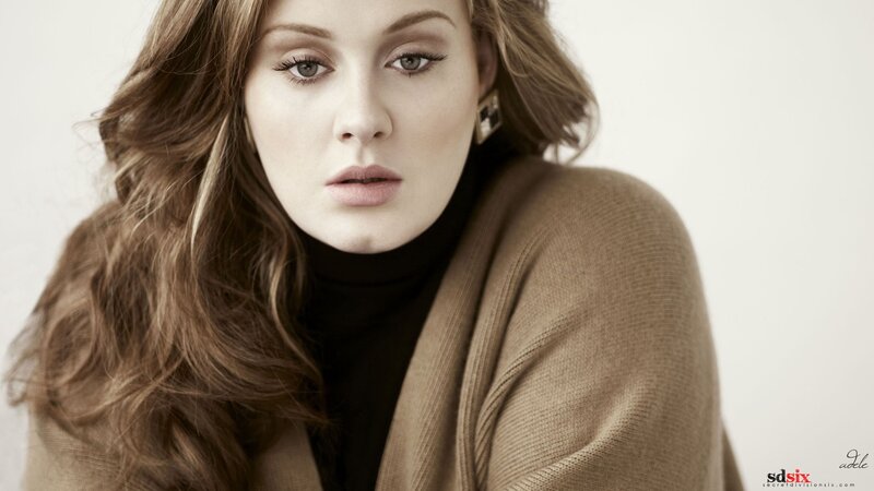 Adele in a brown cardigan