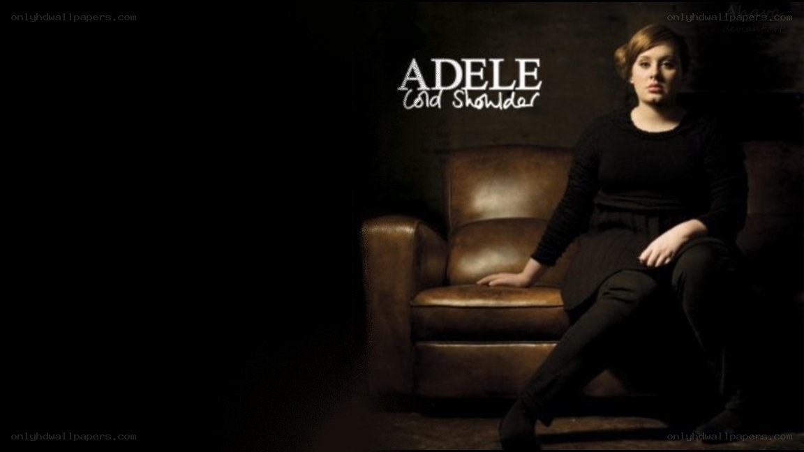 Adele on a leather chair