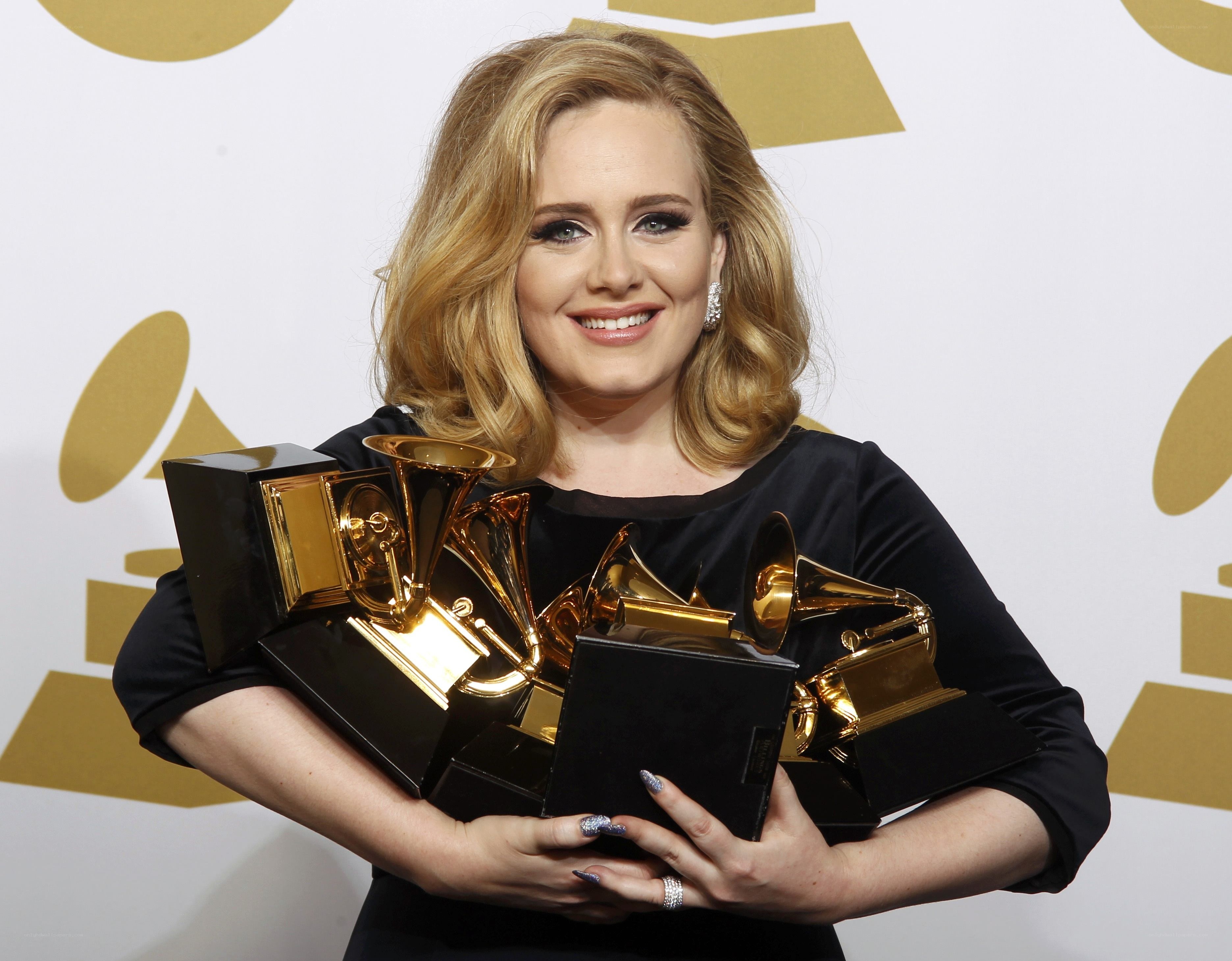 Adele with Grammy awards