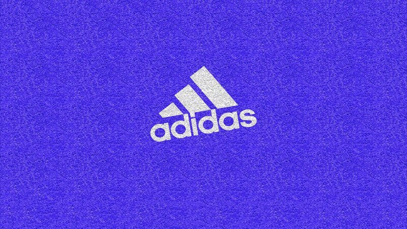 Adidas logo on blue surface