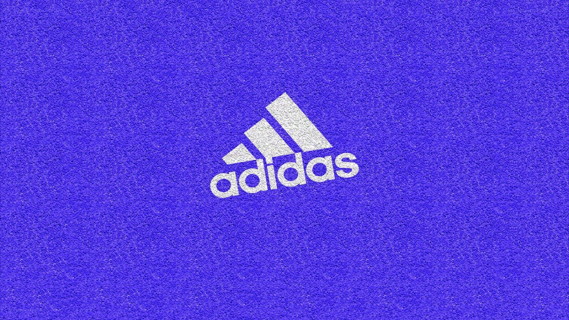 Adidas logo on blue surface