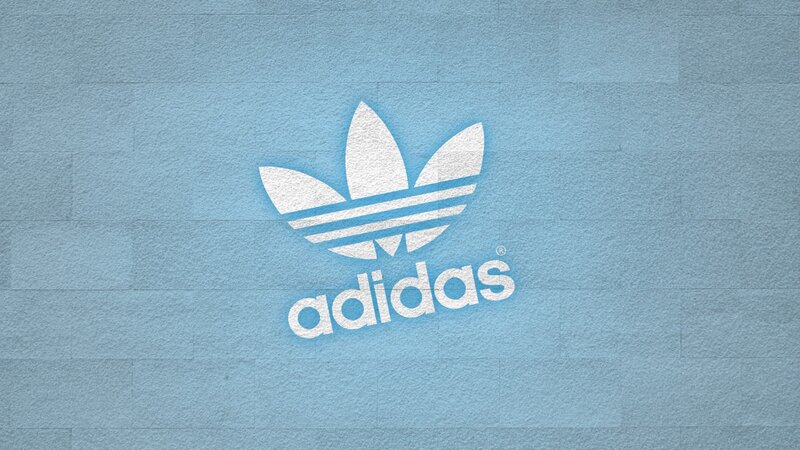 Adidas logo on blue wall