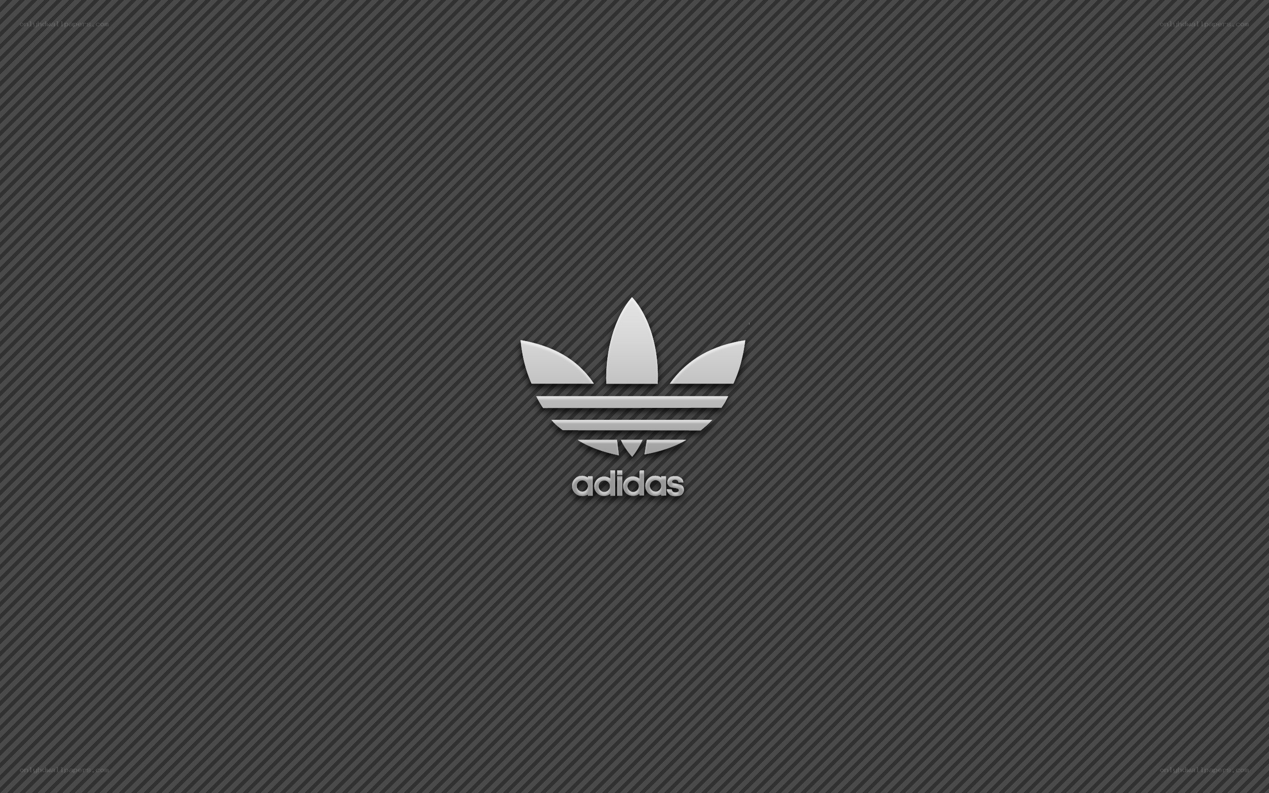 Adidas logo on dark background
