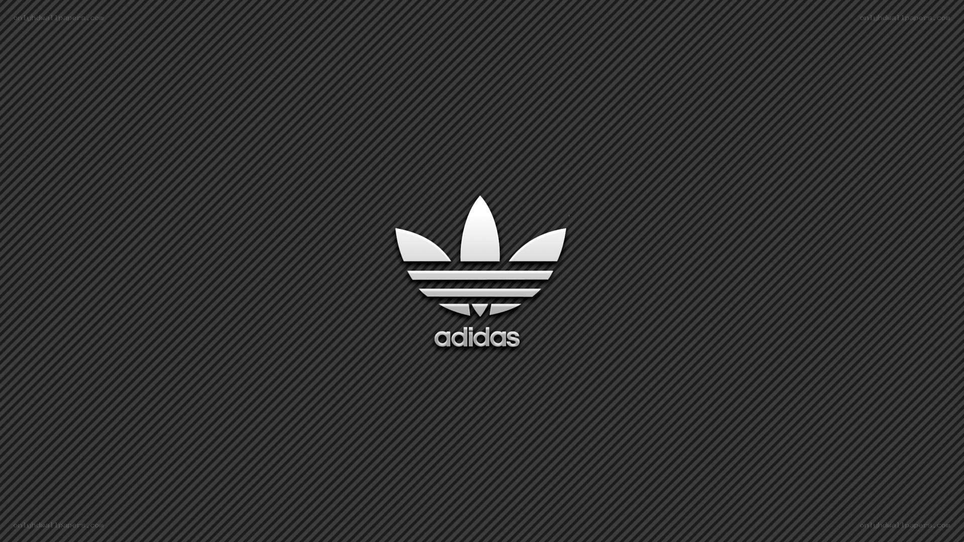 Adidas logo on dark background