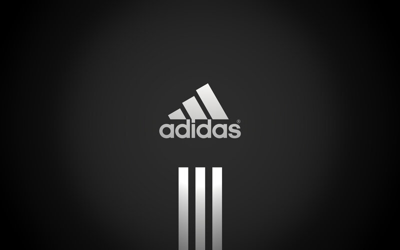 Adidas logo on dark background