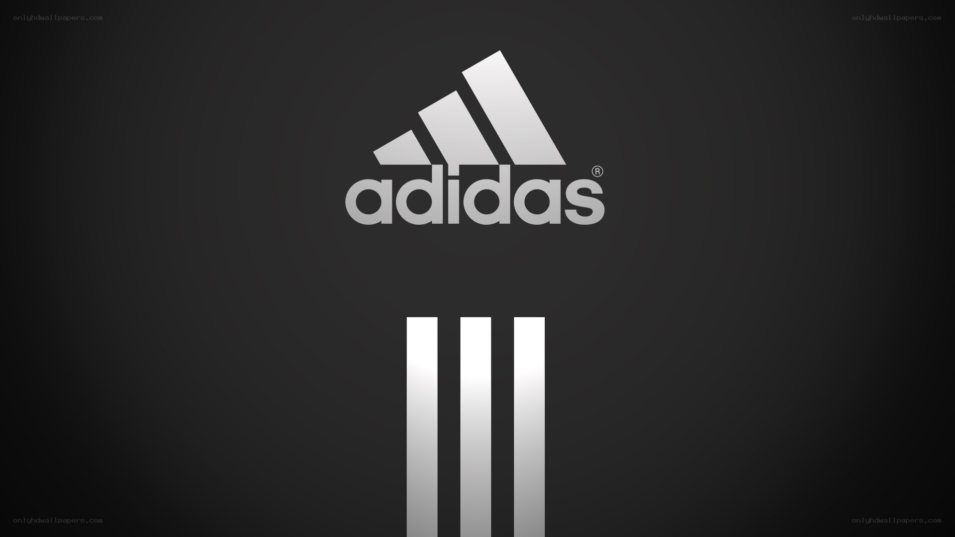 Adidas logo on dark background