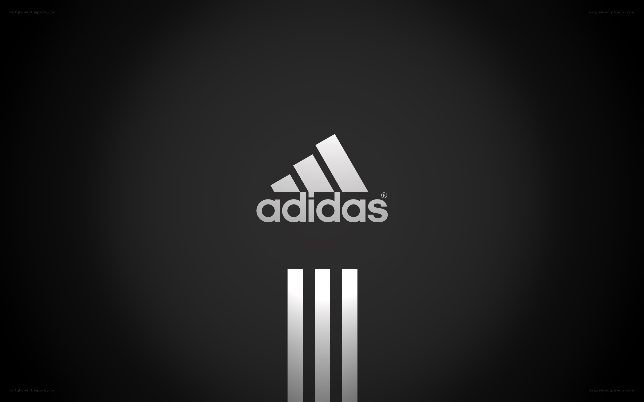 Adidas logo on dark background