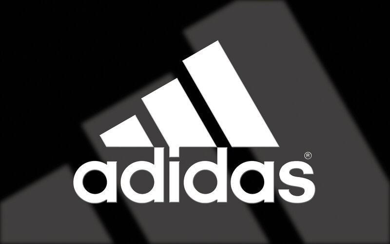 Adidas logo on dark background