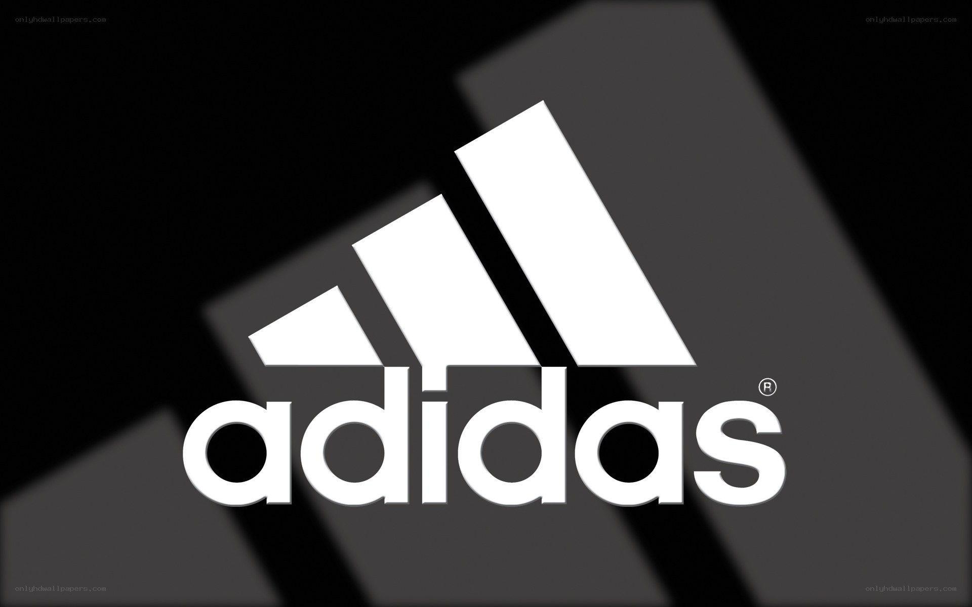 Adidas logo on dark background