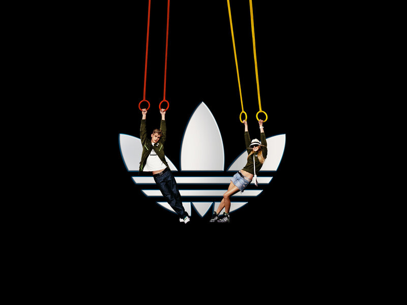 Adidas logo with models on rings