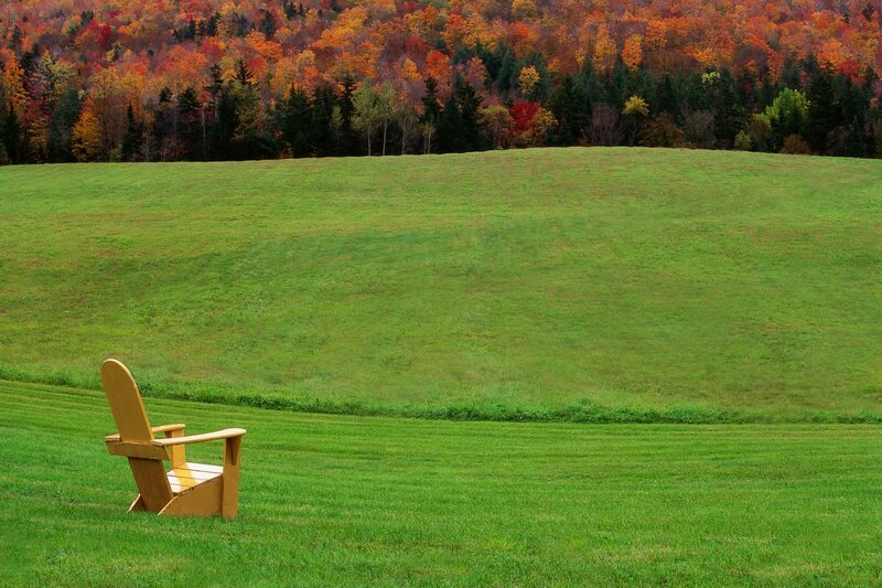 Adirondack chair in autumn field