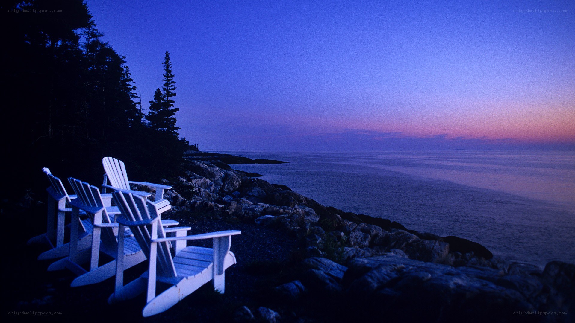 Adirondack chairs at dusk