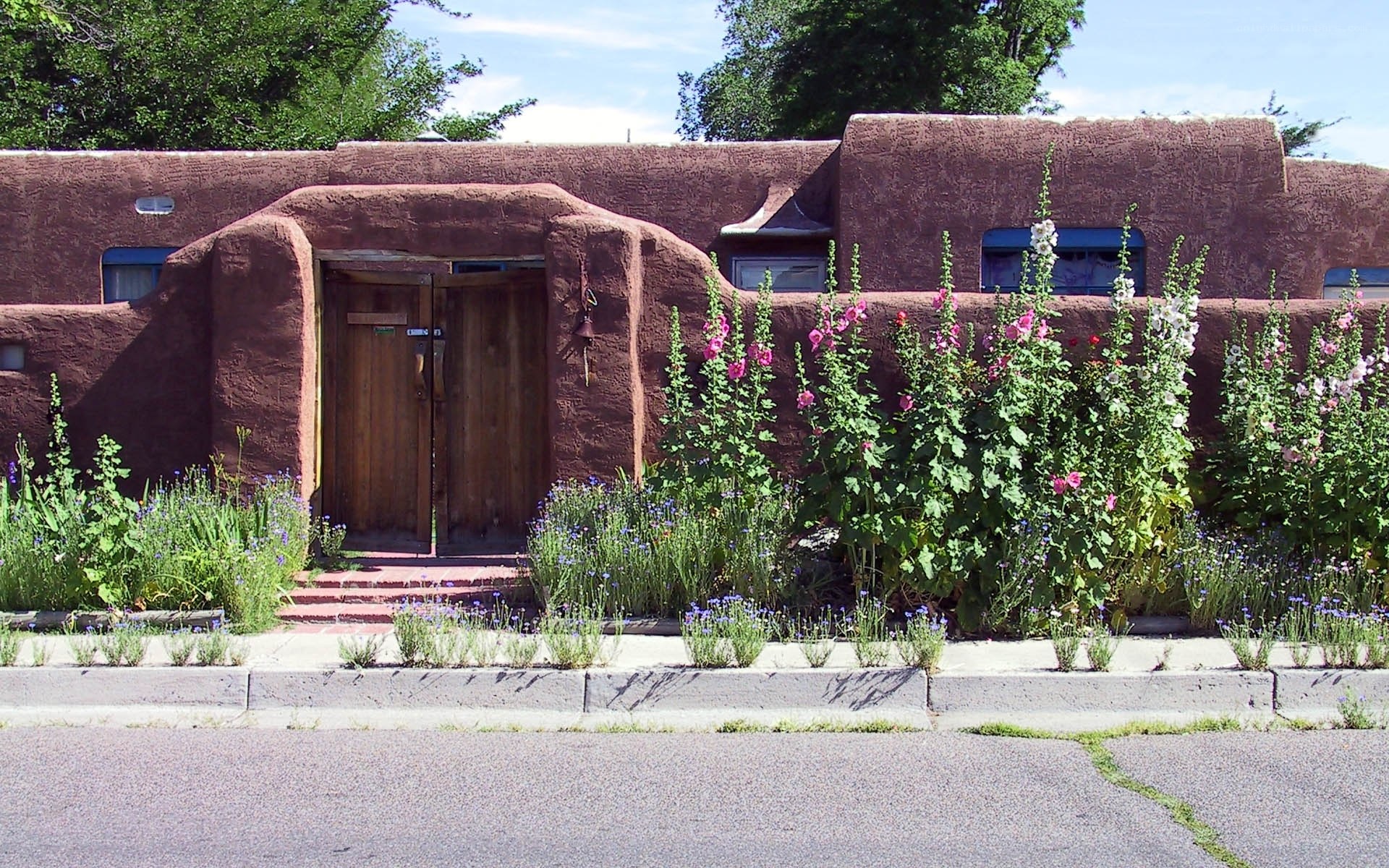 adobe house with flowers