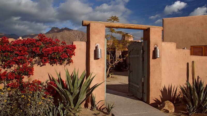 Adobe-style gate with mountain view