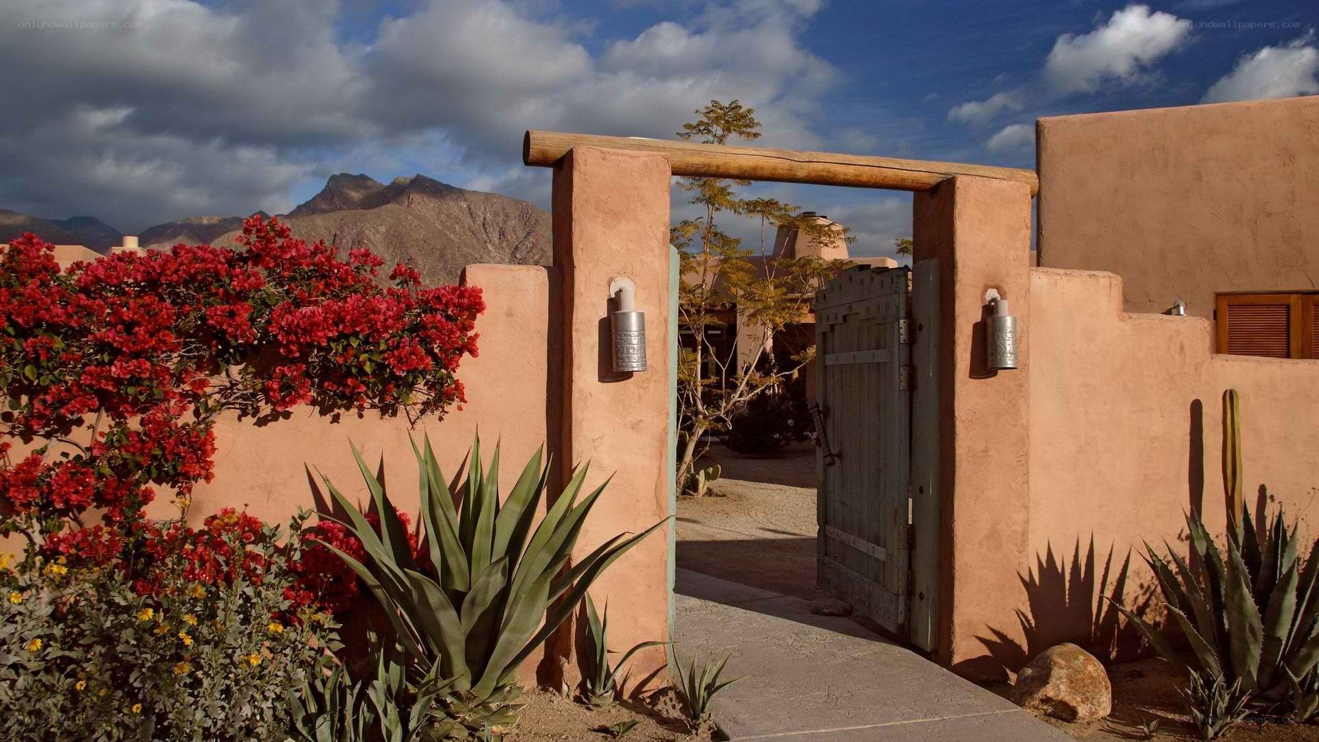 Adobe-style gate with mountain view