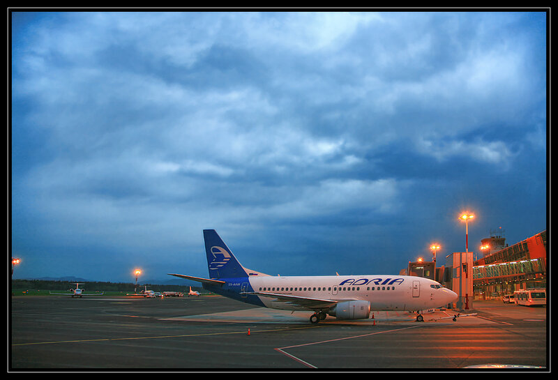 Adria airplane at airport terminal