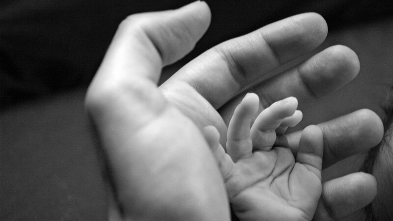 Adult and Baby Hands — Black, Tender, Photograph