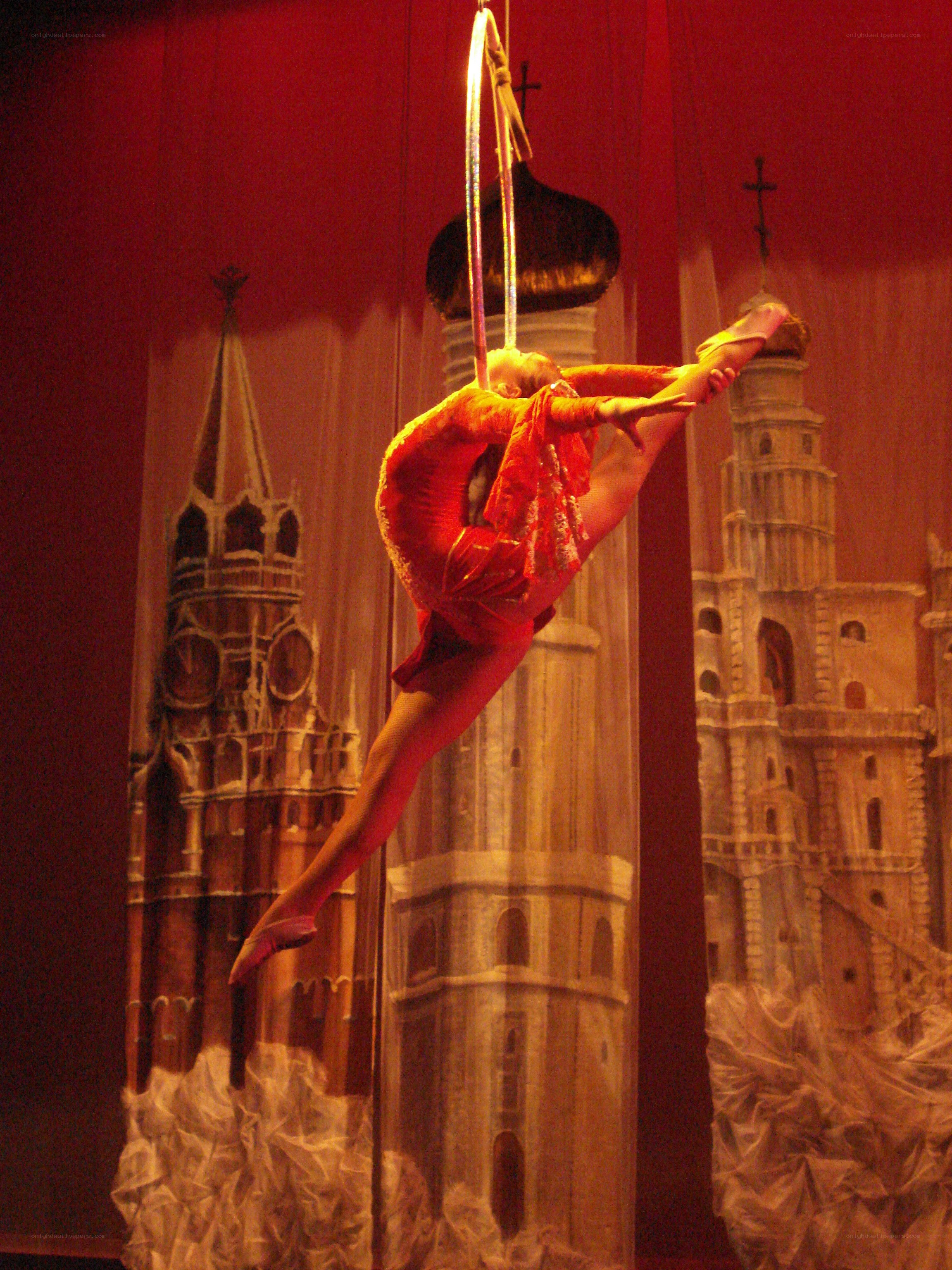 Aerial acrobat in red costume